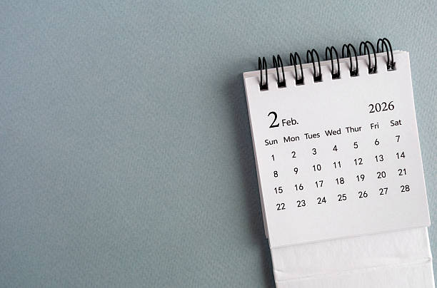 istock A 2026 calendar, open to February. The calendar is lying on a gray surface. 2253219021