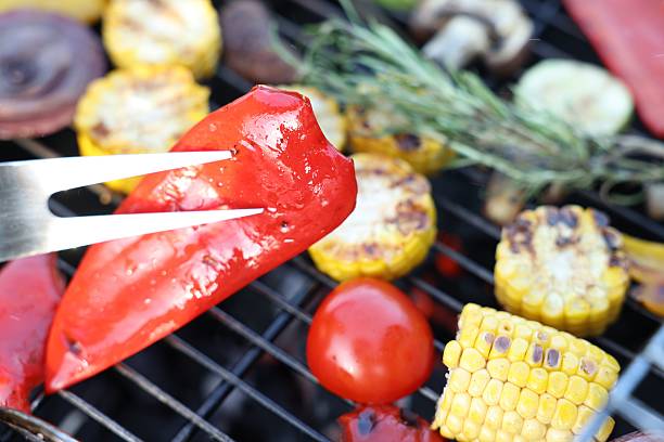Vegetarian barbeque. Many different cooked vegetables on grill, closeup