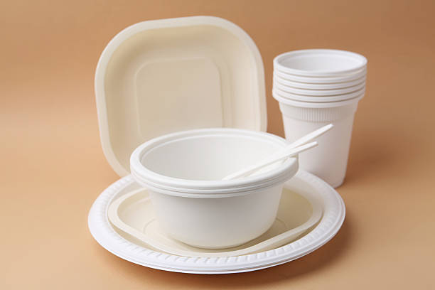 istock Set of disposable plastic tableware on beige background, closeup 2253227399
