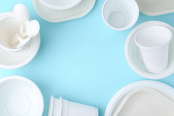 istock Set of disposable plastic tableware on light blue background, flat lay. Space for text 2253227409