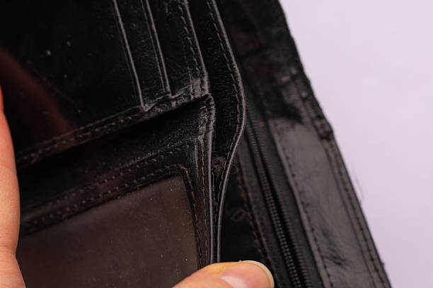 Open empty black wallet with card slots