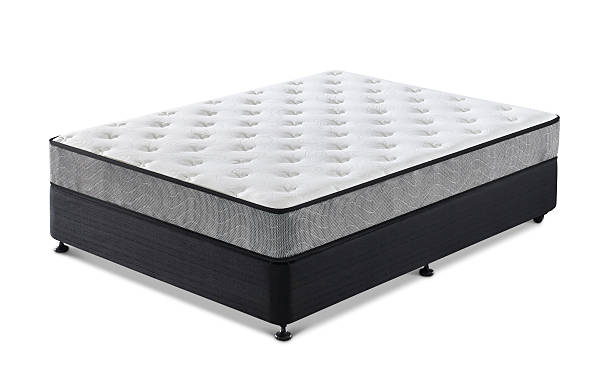 istock Comfortable white mattress on black bed base Isolated on White Background. 2253228476