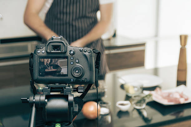 istock DSLR camera on a tripod record video. 2253229804