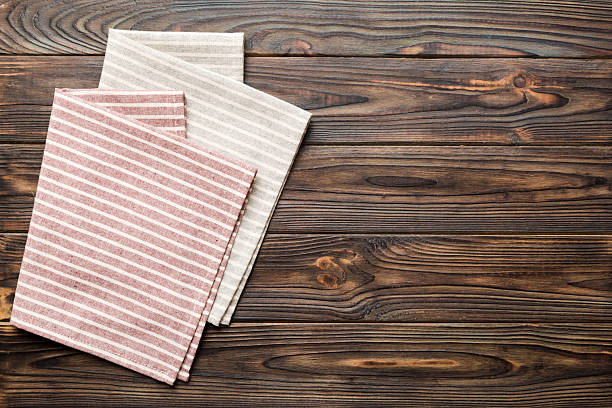 istock top view with red empty kitchen napkin isolated on table background. Folded cloth for mockup with copy space, Flat lay. Minimal style 2253230774