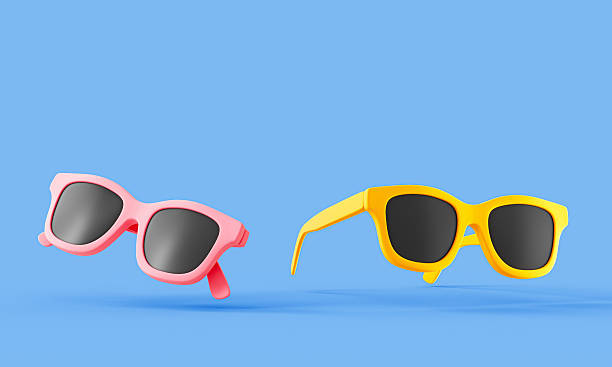 istock 3D sunglasses icon illustration in bright colors. Minimal 3D render of a pink and yellow sunglasses pair on a blue background, symbolizing summer, fashion, or vacation. 2253231509