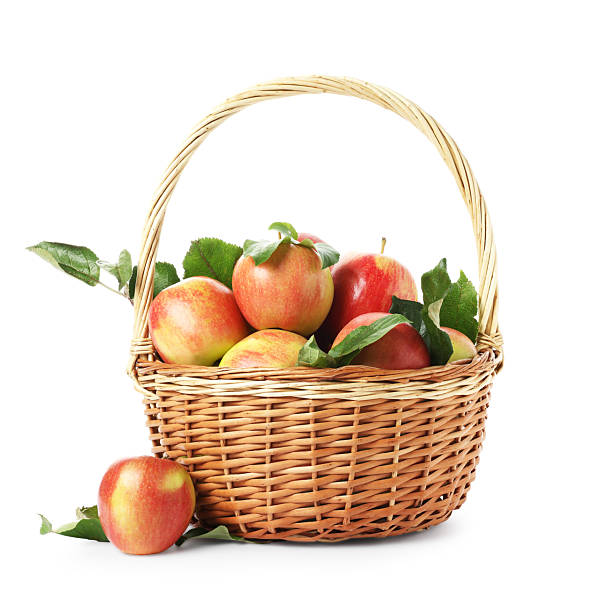 Fresh ripe apples in wicker basket isolated on white