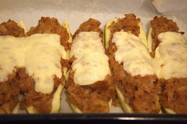 istock Stuffed Zucchini with Melted Cheese on Baking Paper 2253232814