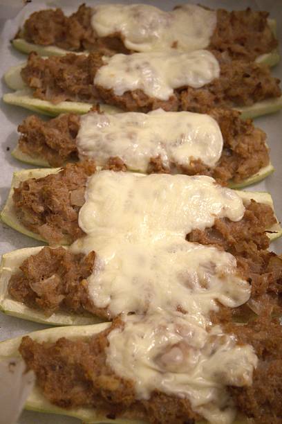 istock Stuffed Zucchini with Melted Cheese on Baking Paper 2253232839