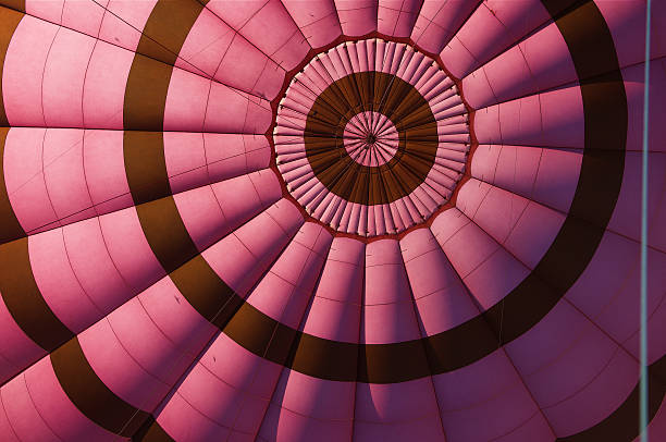 Colorful sunset with hot air balloon in the water reflection