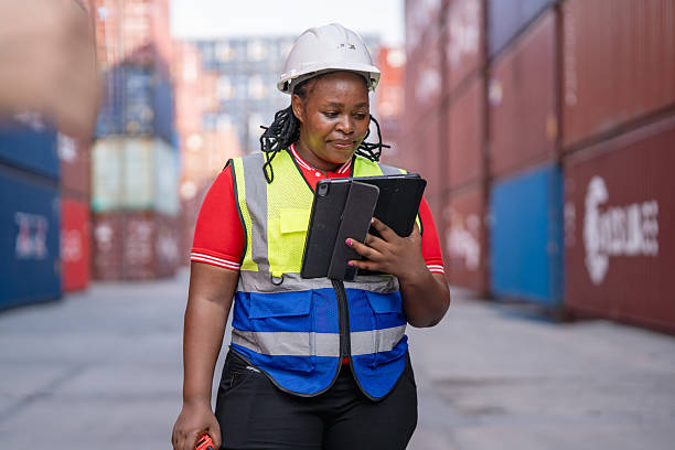 istock Logistics professional utilizing technology at shipping yard industrial environment portrait perspective for efficiency 2253238482