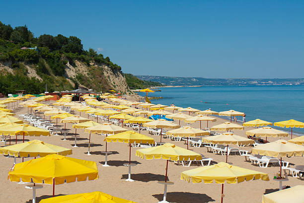 Golden sands, Bulgaria - June 02, 2015: umbrellas on sea beach.
