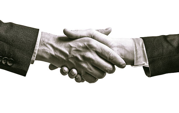 istock Black and white image of a firm handshake. 2253241514