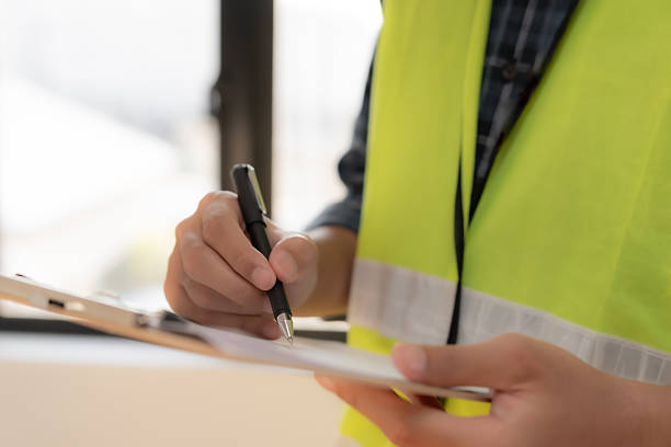 istock inspector or engineer is inspecting construction and quality assurance new house using a checklist. Engineers or architects or contactor work to build the house before handing it over to the homeowner 2253241738