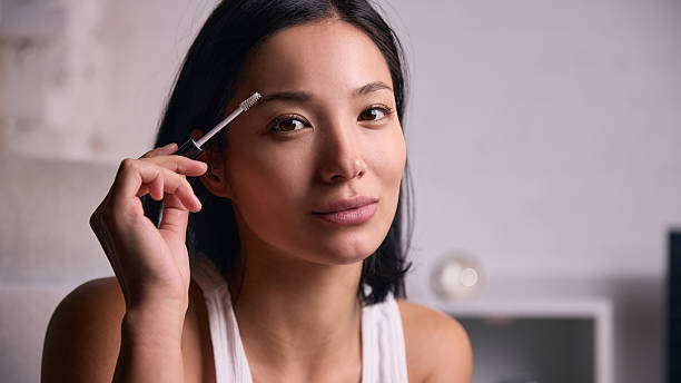 istock Woman shaping eyebrows during beauty grooming routine 2253241781