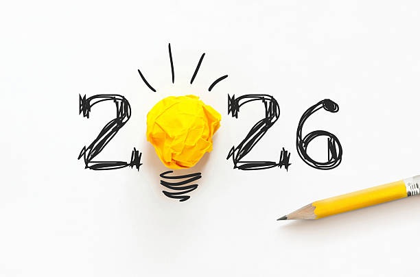 istock Creative 2026 concept with hand-drawn numbers and a yellow paper light bulb on white. A minimalist metaphor for new year innovation, bright ideas, business goals, and creative thinking 2253242710