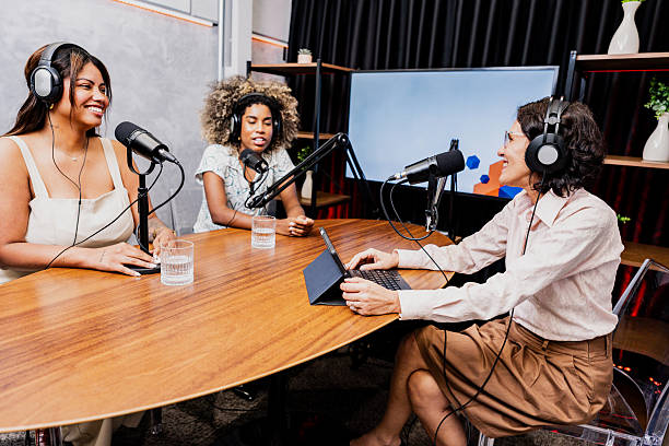 istock Podcast host talking with guests on a studio - including a bisexual young woman 2253251697