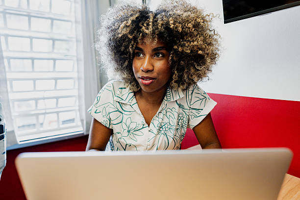 istock Young woman talking during a business at office 2253251764