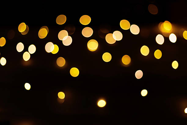 istock Christmas golden light bokeh on dark background. 2253252126