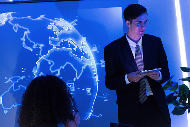 istock Business presentation on global technology trends in modern office setting with interactive display 2253252594