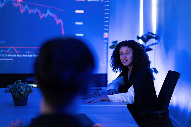 istock Business meeting in a modern office with a focus on financial data and technology 2253252601
