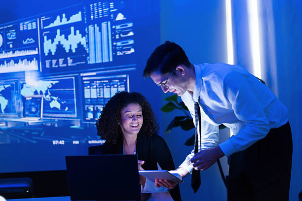 istock Business team collaborates on data analysis in modern office setting during evening meeting 2253252612