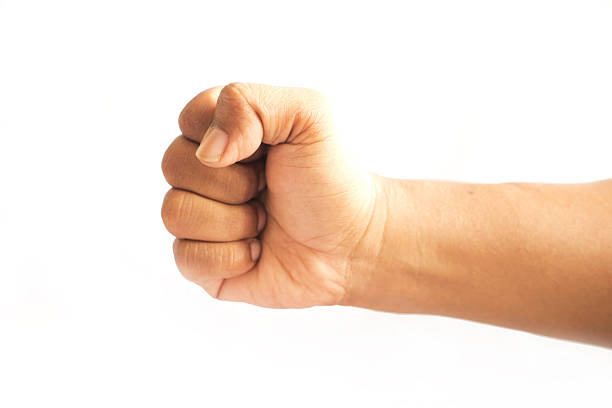 istock Clenched Hand Symbolizing Strength isolated on white 2253254517