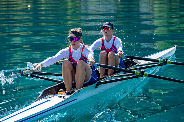 istock Medium Shot of Two Female Rowers Displaying Strength and Determination 2253254907