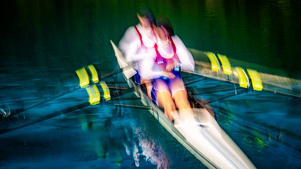 istock Blurred Motion Intense Rowing on Serene Lake 2253254915