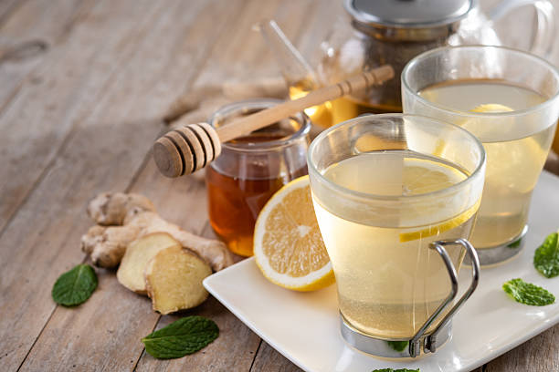 istock Ginger tea with honey and lemon in a cup. 2253256261