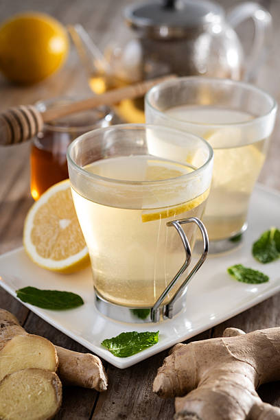 istock Ginger tea with honey and lemon in a cup. 2253256290