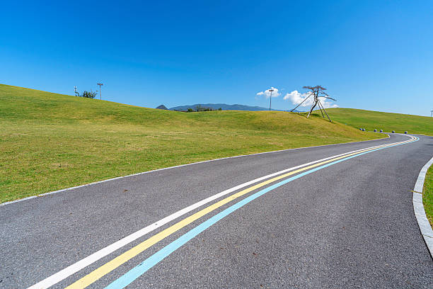 A sharp turn on a high road with beautiful scenery on a sunny day