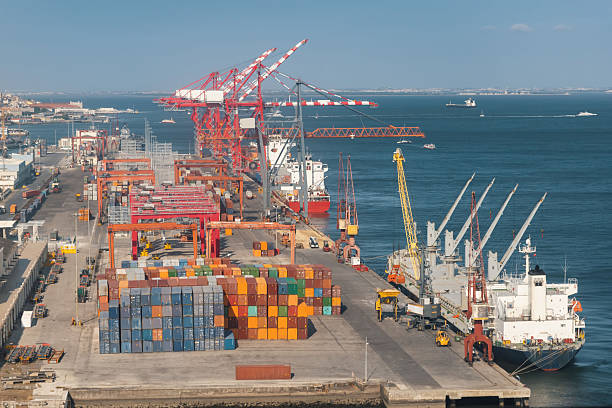 istock Ships stand at the seaport with large loading cranes 2253260339
