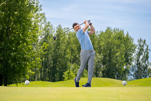 istock Caucasian Man Completing Golf Swing with Focused Precision 2253260517