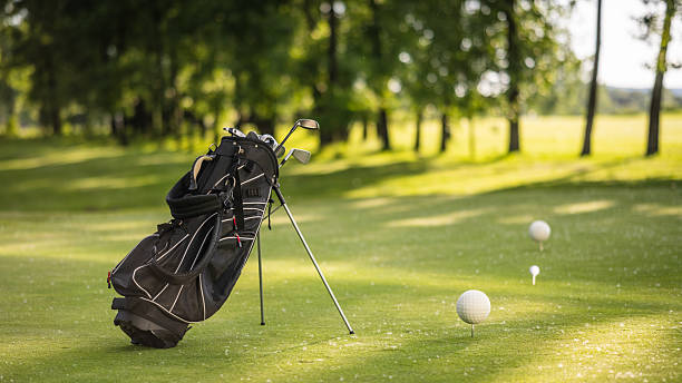 istock Golf Bag Stationed on Fairway with Tee Balls Nearby 2253260800