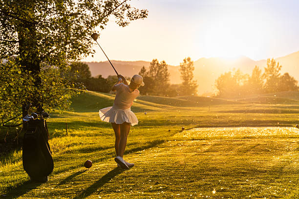 istock Young Caucasian Female Golfer Enjoying Evening Drive on Scenic Course 2253260832