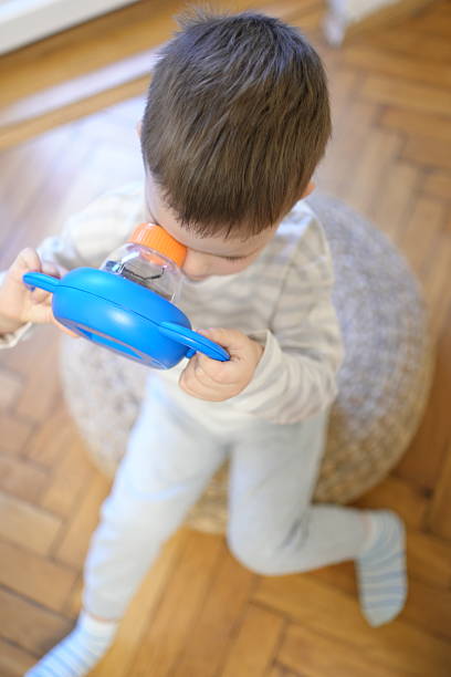 istock Child Observing a Cockroach Close Up 2253260955