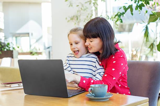istock Mother and Daughter Using Laptop Together at Home 2253266643