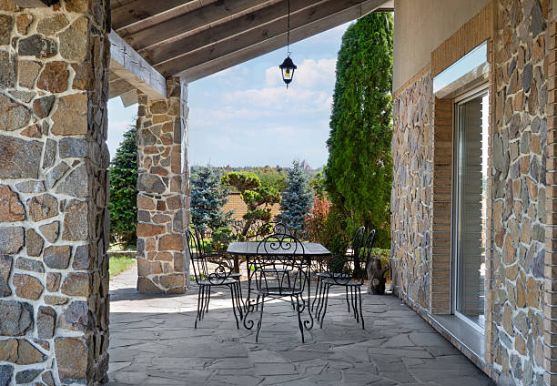 istock Rustic Stone Terrace Veranda with Outdoor Dining and Scenic Landscape View 2253269407