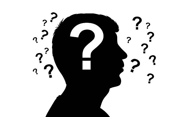 istock Silhouette of Person Surrounded by Question Marks Illustrating Uncertainty 2253269437