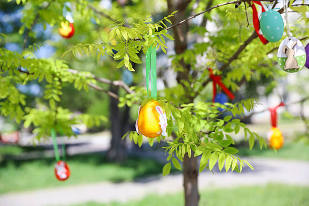 Easter eggs kids crafts hanging on tree branch
