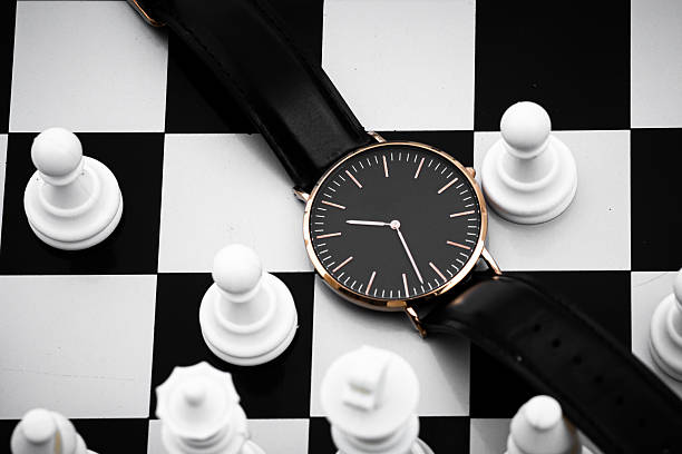 istock Minimalist Wristwatch on Chessboard Representing Time and Strategy 2253273682