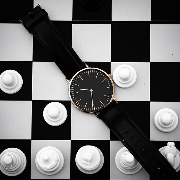 istock Minimalist Wristwatch on Chessboard Representing Time and Strategy 2253273696