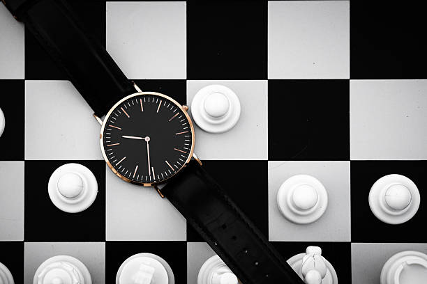 istock Minimalist Wristwatch on Chessboard Representing Time and Strategy 2253273718