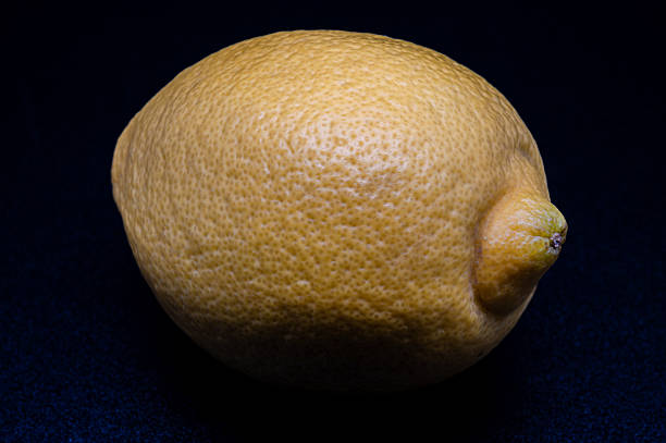 Slices of fresh lemon close up on yellow background