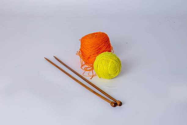 green woolen skein on a green background. High quality photo