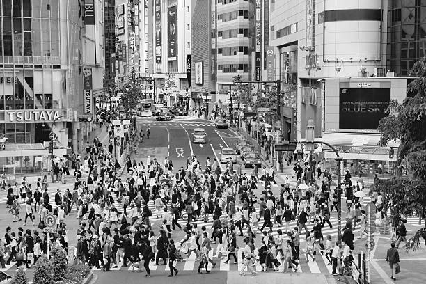 People walk the Hachiko crossing in Shibuya, Tokyo. Shibuya crossing is one of busiest places in Tokyo.