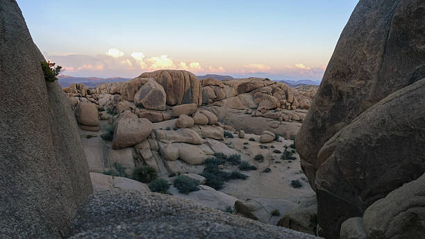 istock Rocky Desert Landscape Framed by Massive Stone Formations at Dusk 2253279393