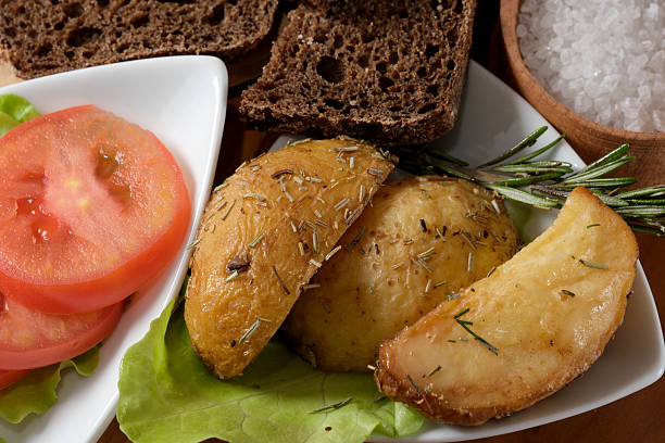 Crispy roasted potatoes paired with fresh tomatoes and a touch of herbs.
