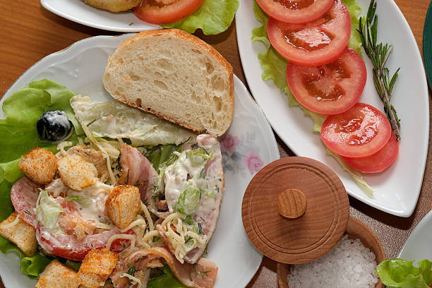 Colorful salad with croutons and tomatoes showcases a delightful dining experience.