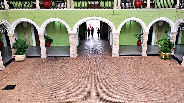 A view from the balcony down on the patio of the palace in Merida, Mexico